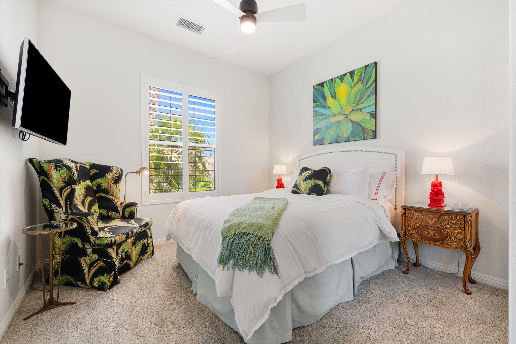 61185 Soaptree Drive La Quinta, CA 92253 - Photo 31 of 51 a bedroom with a bed and flat screen tv