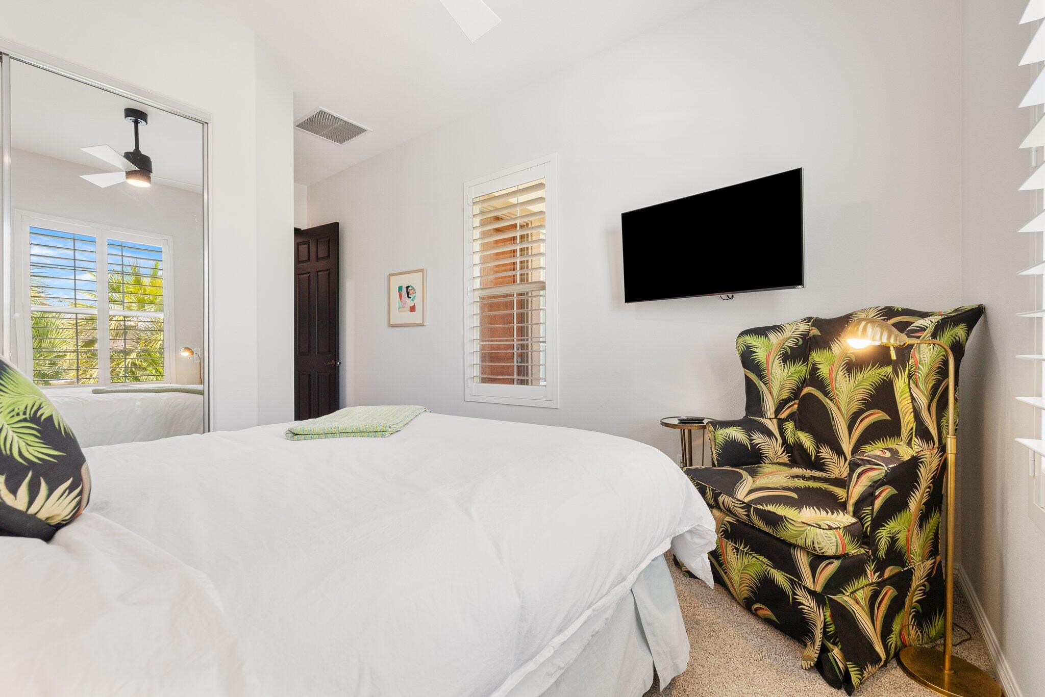 61185 Soaptree Drive La Quinta, CA 92253 - Photo 32 of 51 a bedroom with a bed and a flat screen tv