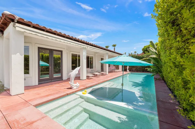 front view of a house with swimming pool