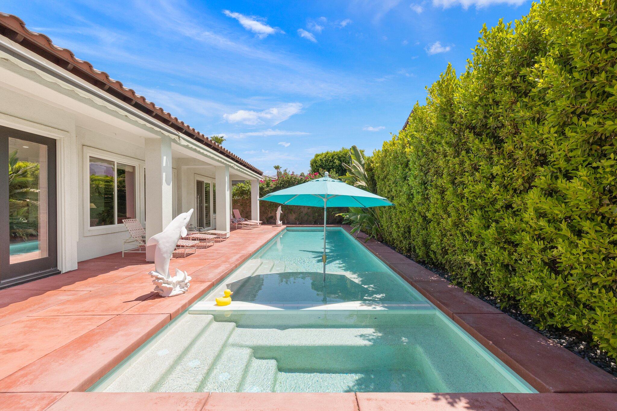 61185 Soaptree Drive La Quinta, CA 92253 - Photo 39 of 51 front view of a house with swimming pool