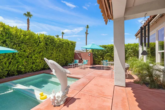 a view of balcony with wooden floor and outdoor seating