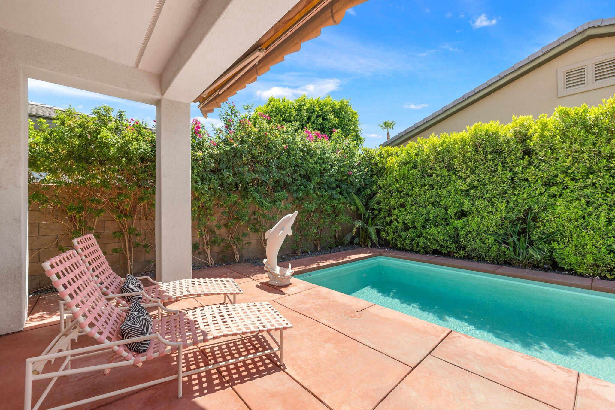 61185 Soaptree Drive La Quinta, CA 92253 - Photo 42 of 51 a view of balcony with wooden floor and outdoor seating