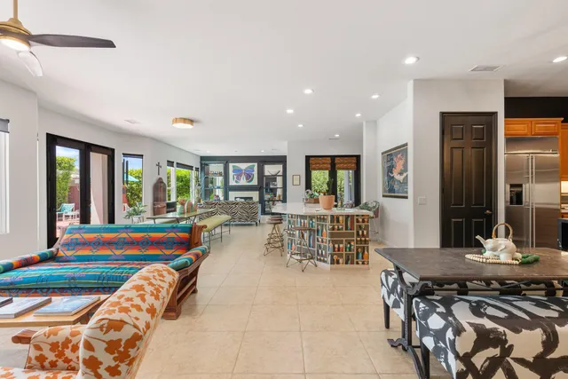 a very nice looking dining room with a large dining table and chairs