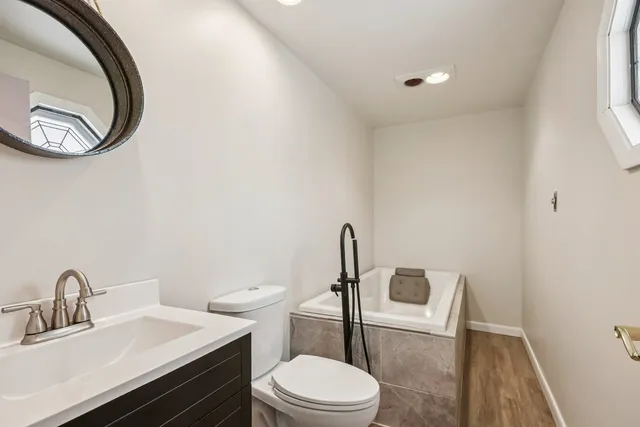 a bedroom with furniture and a window