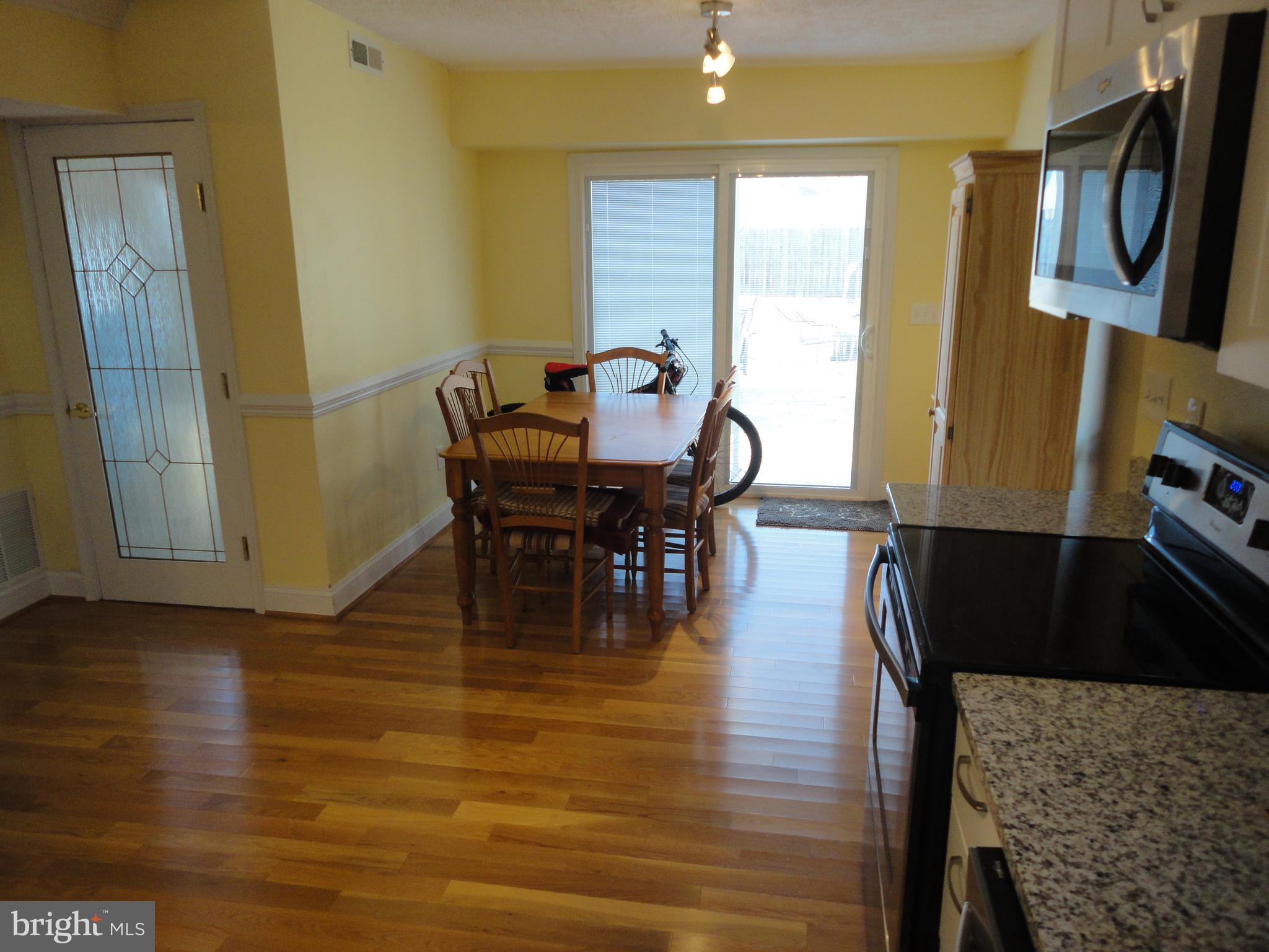 7818 Harbor Road Pasadena, MD 21122 - Photo 10 of 23 Dining Area Opening to Deck