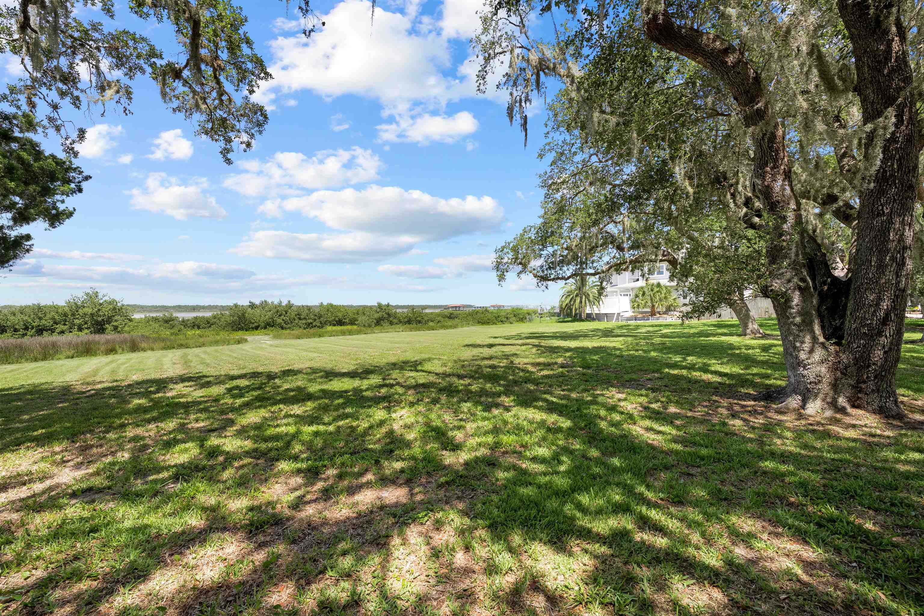 5425 B Windantide Road St. Augustine, FL 32080 - Photo 9 of 34 a view of a field with an ocean