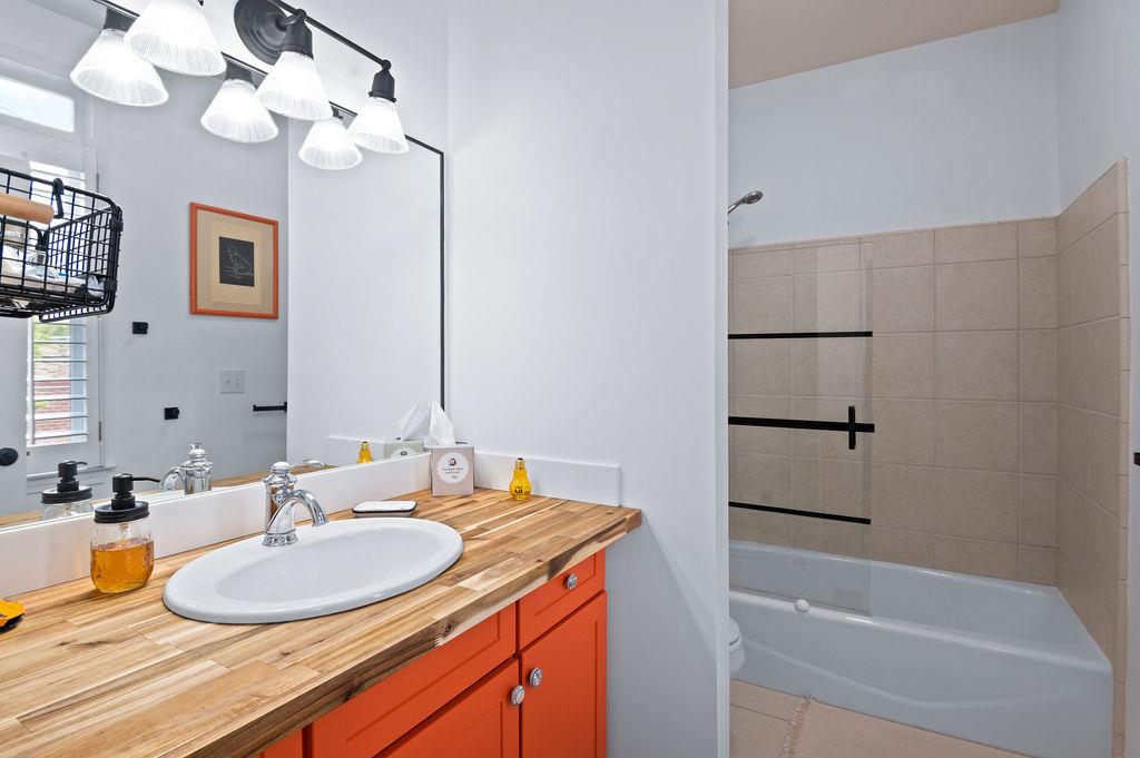 230 Bradberry Street Southwest, Unit 9 Atlanta, GA 30313 - Photo 19 of 36 a bathroom with a sink a bathtub and a mirror