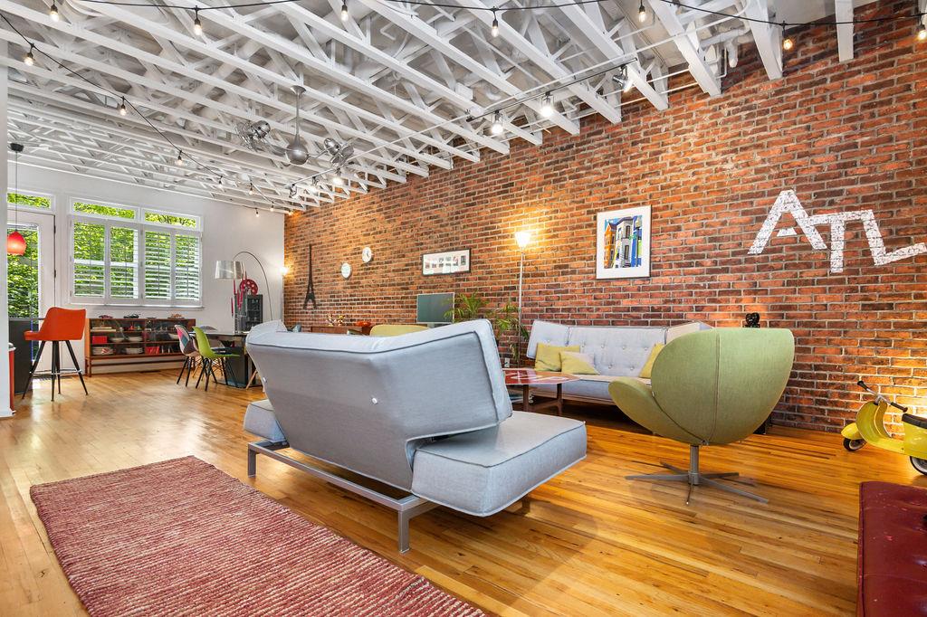 230 Bradberry Street Southwest, Unit 9 Atlanta, GA 30313 - Photo 7 of 36 a living room with furniture and a large window
