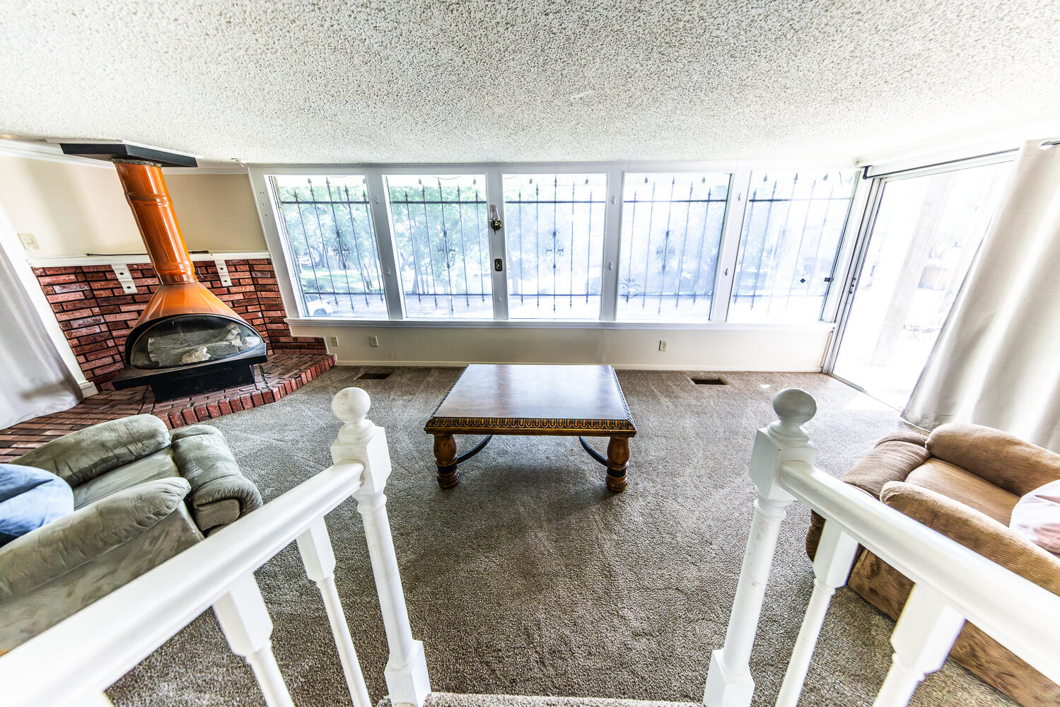 585 Comanche Drive Lubbock, TX 79404 - Photo 5 of 17 a living room with furniture and a large window