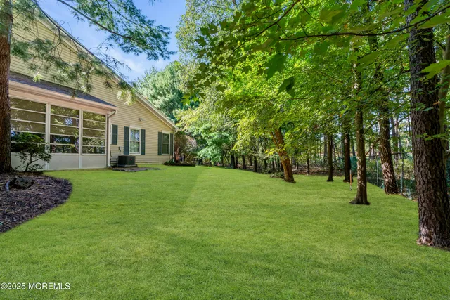 a view of a house with a backyard