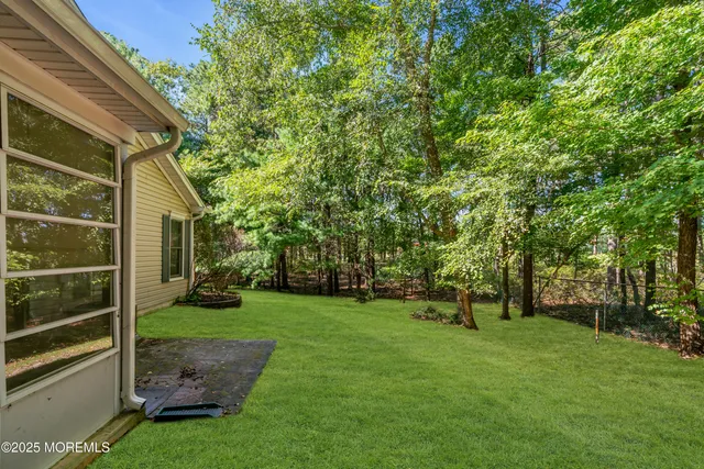 a view of a house with backyard