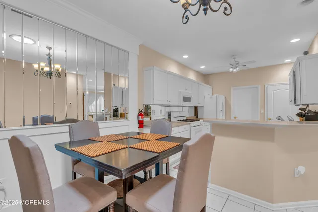 a view of kitchen with cabinets and wooden floor