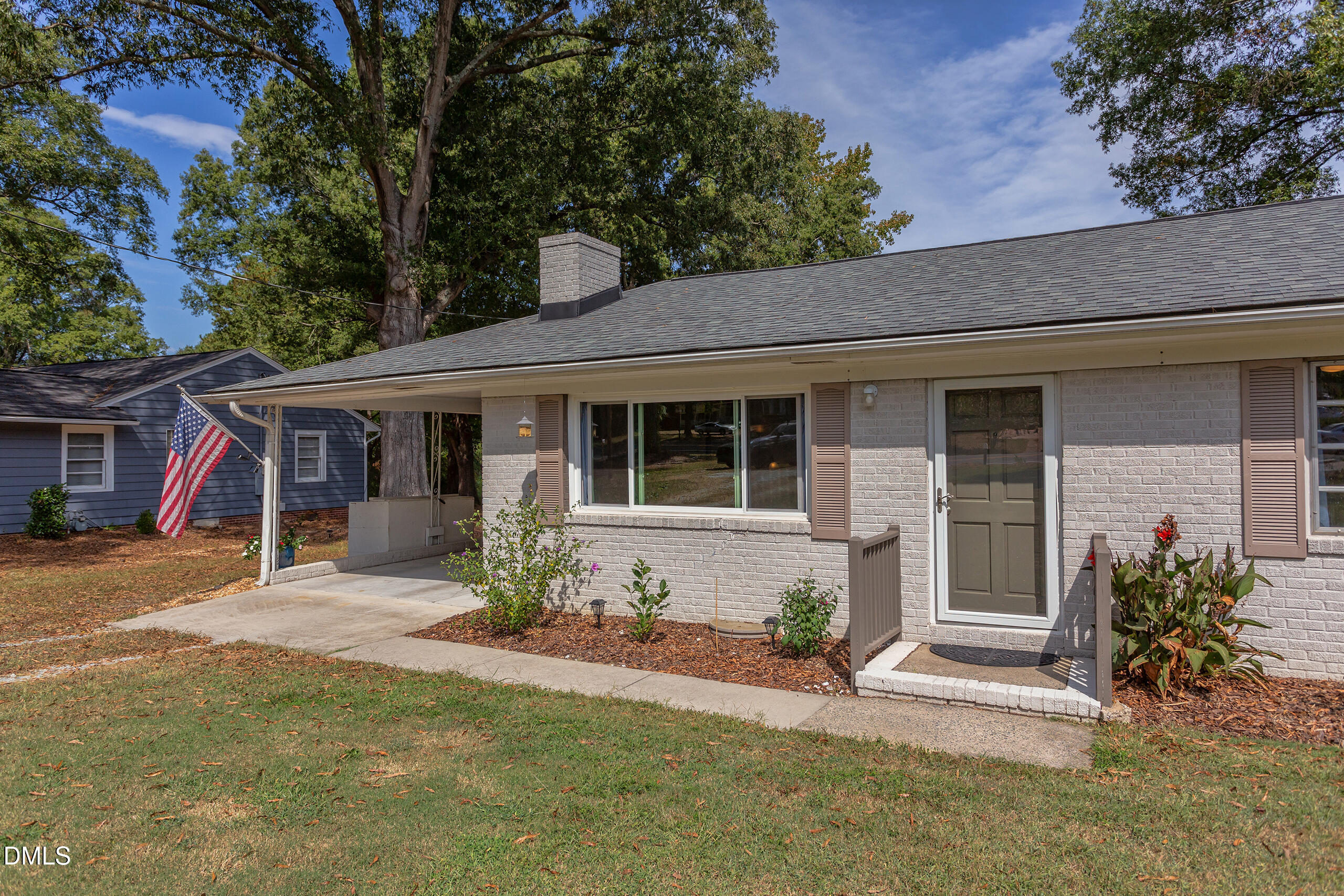 1102 Horton Road Durham, NC 27704 - Photo 3 of 31 a front view of a house with a yard and outdoor seating
