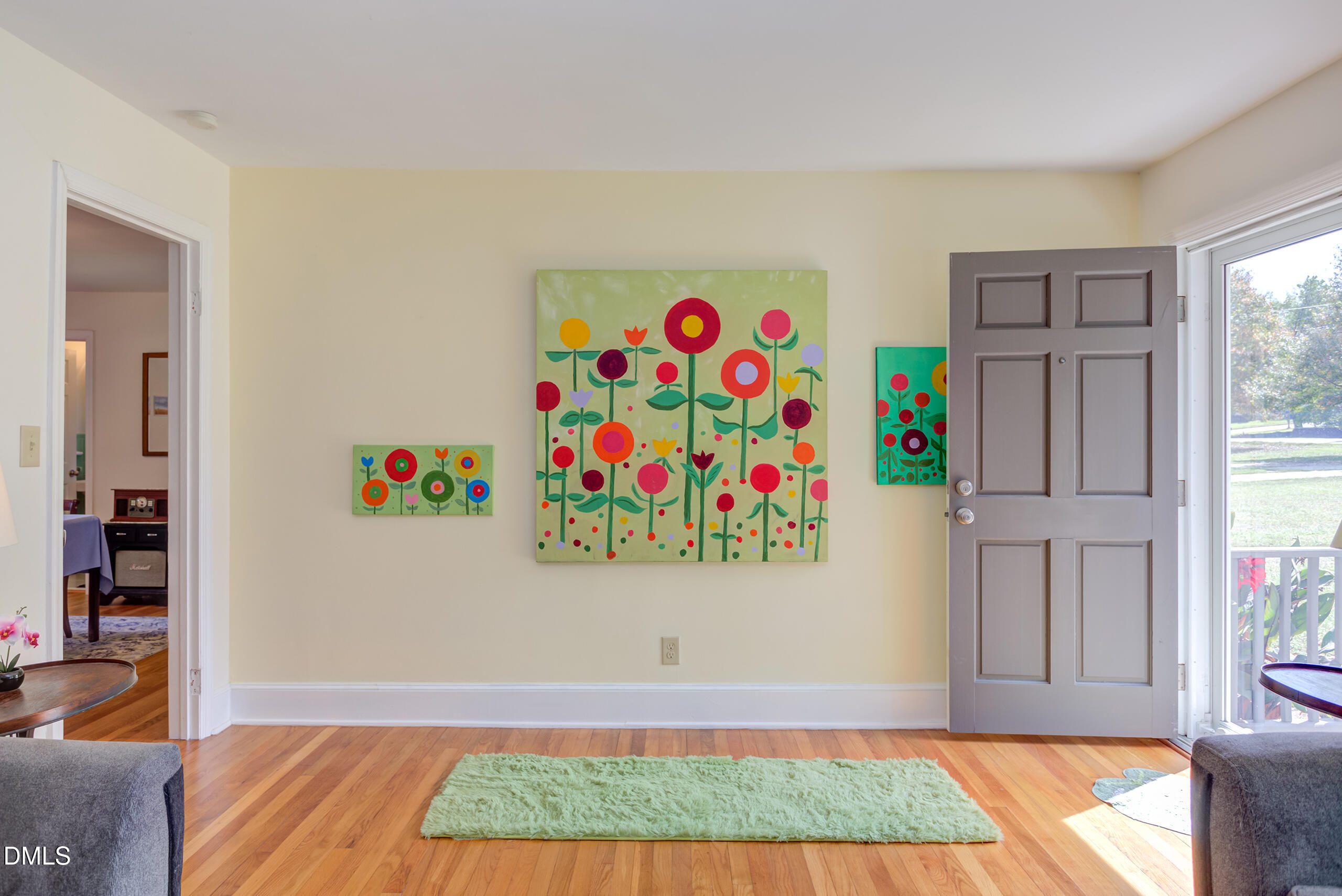 1102 Horton Road Durham, NC 27704 - Photo 4 of 31 a room with painting on the wall and a window