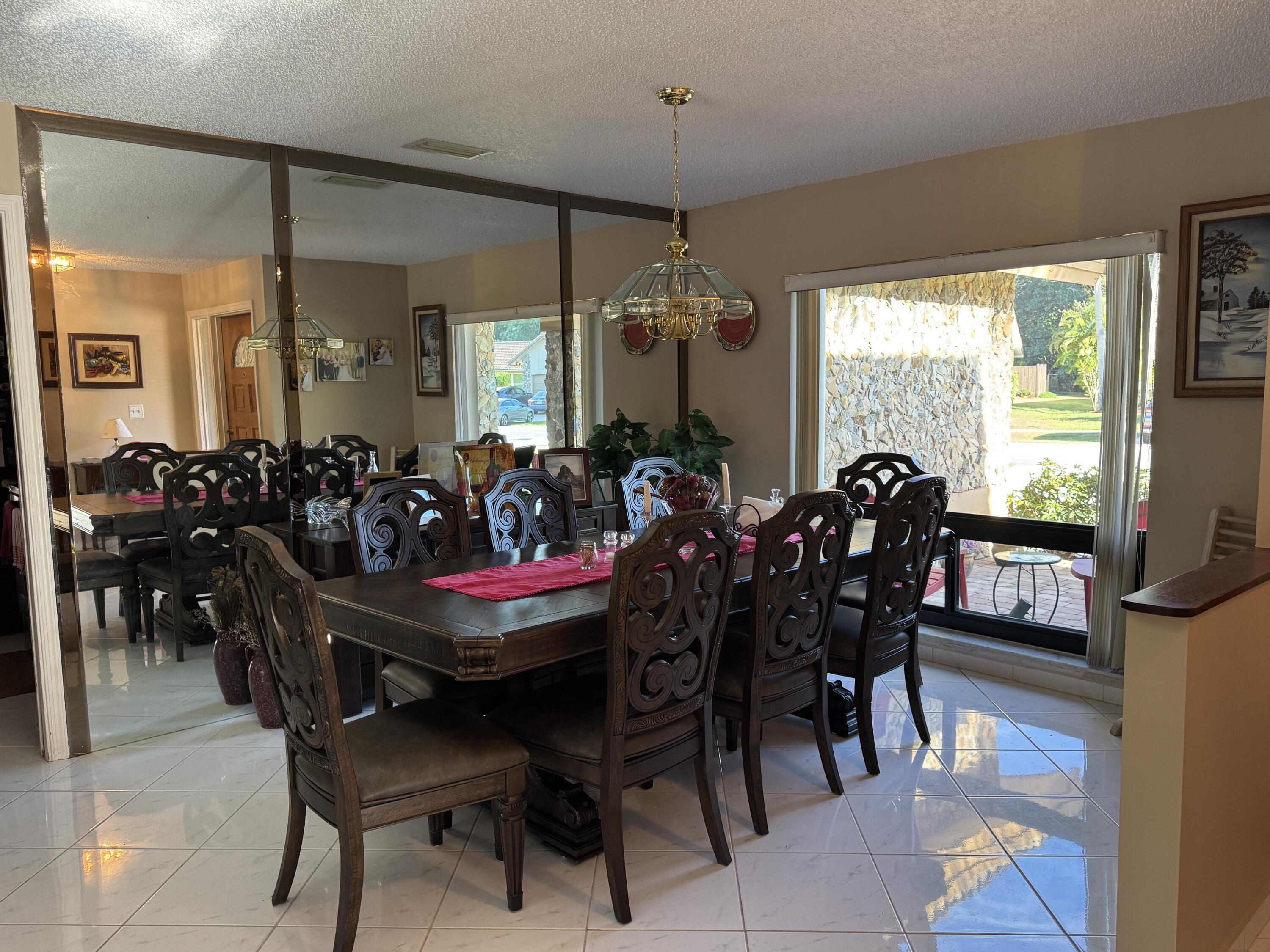 21149 Shady Vista Lane Boca Raton, FL 33428 - Photo 12 of 32 a view of a dining room with furniture window and outside view