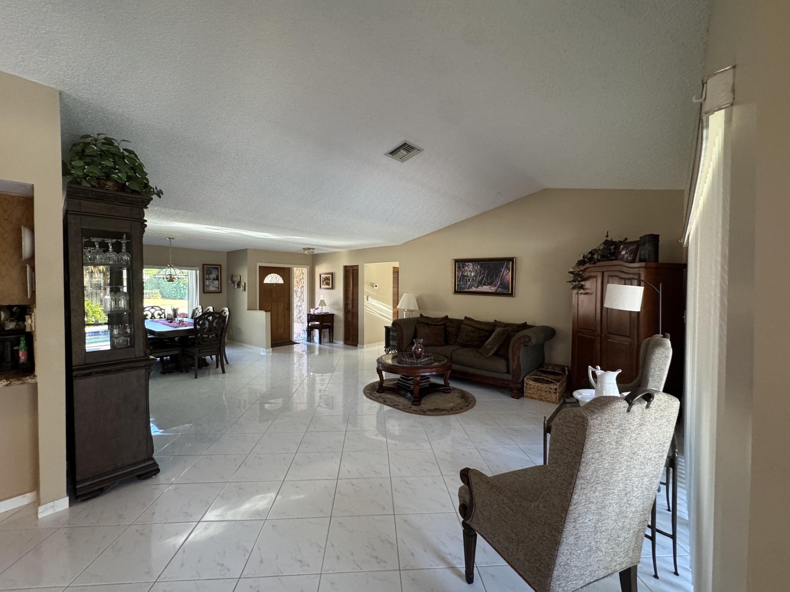 21149 Shady Vista Lane Boca Raton, FL 33428 - Photo 14 of 32 a living room with furniture and a couch