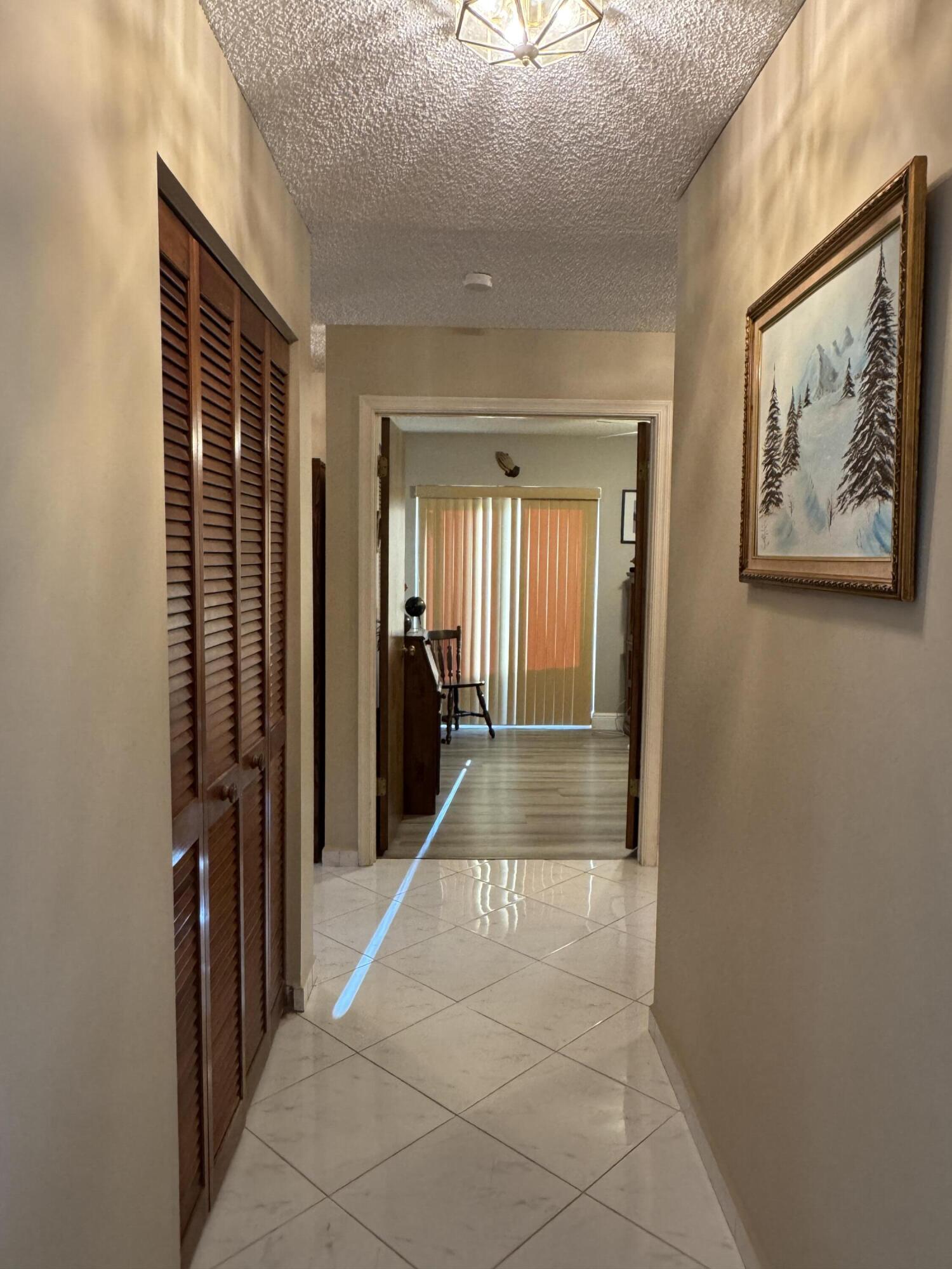 21149 Shady Vista Lane Boca Raton, FL 33428 - Photo 21 of 32 a view of a hallway with a elevator
