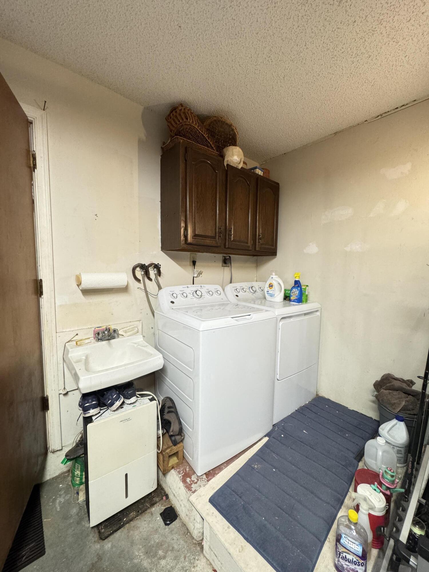 21149 Shady Vista Lane Boca Raton, FL 33428 - Photo 32 of 32 a utility room with cabinets washer and dryer