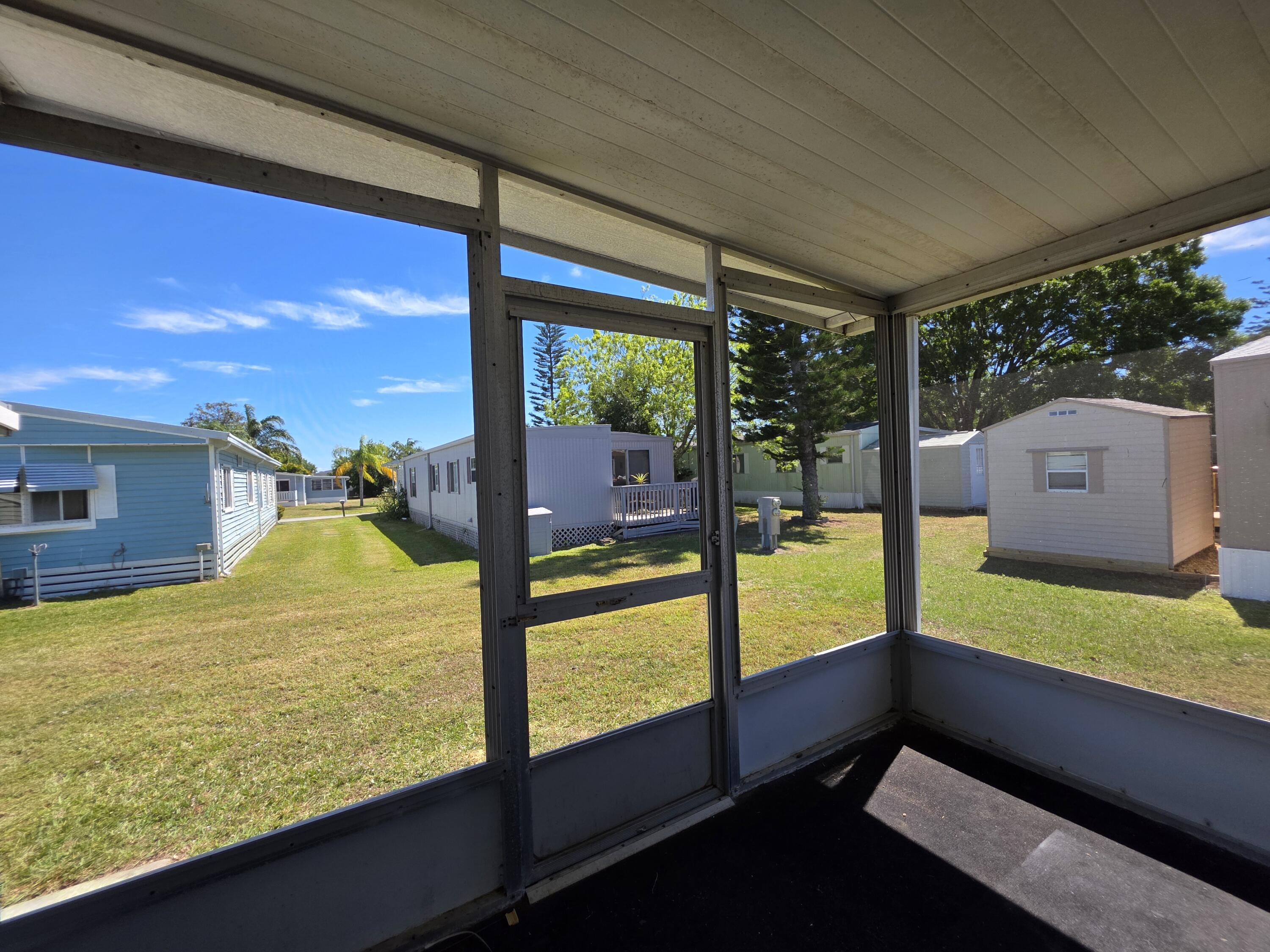 8 Del Sol Port St. Lucie, FL 34952 - Photo 25 of 26 a view of a back yard from a balcony