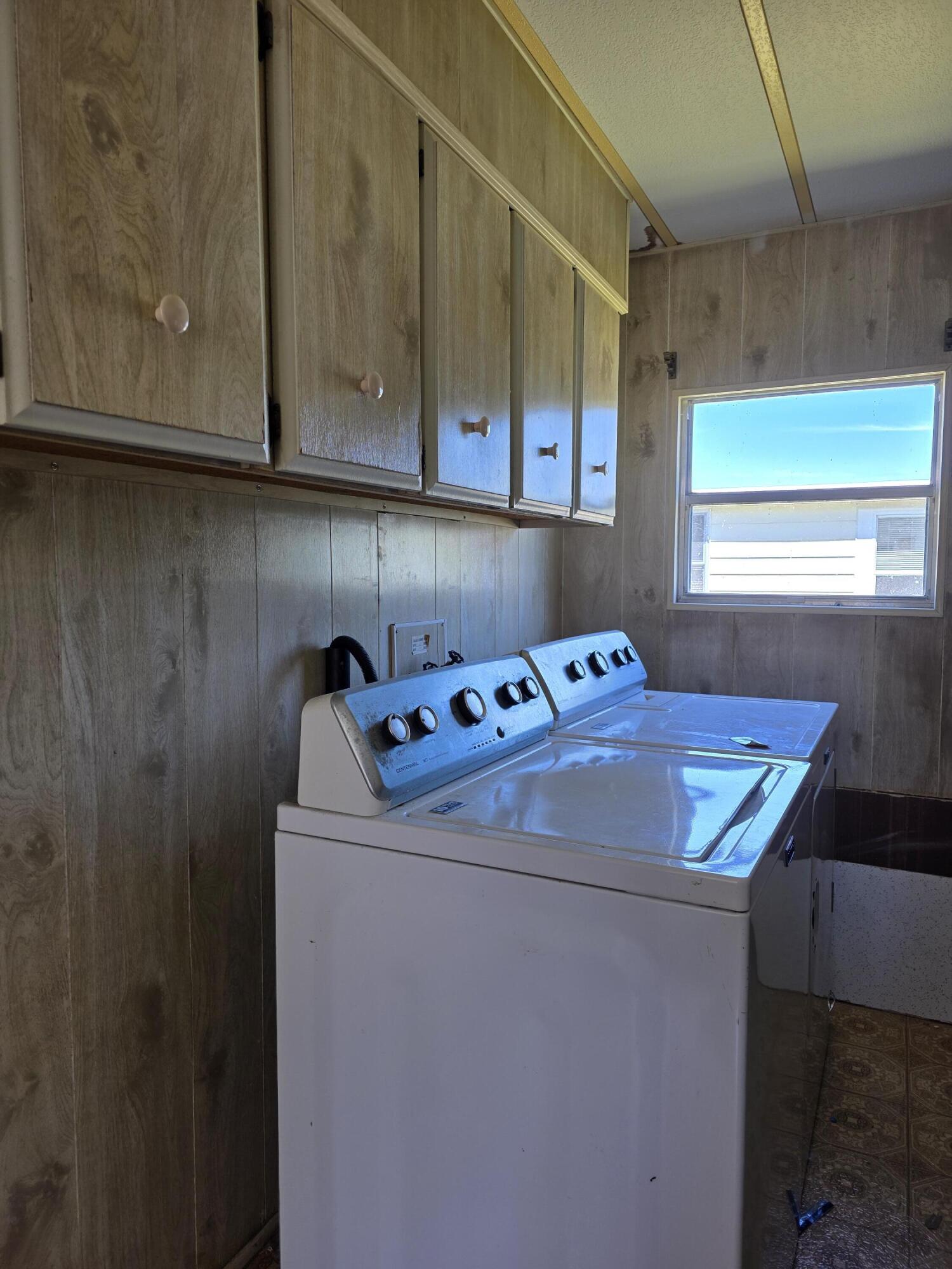 8 Del Sol Port St. Lucie, FL 34952 - Photo 26 of 26 a utility room with dryer and washer
