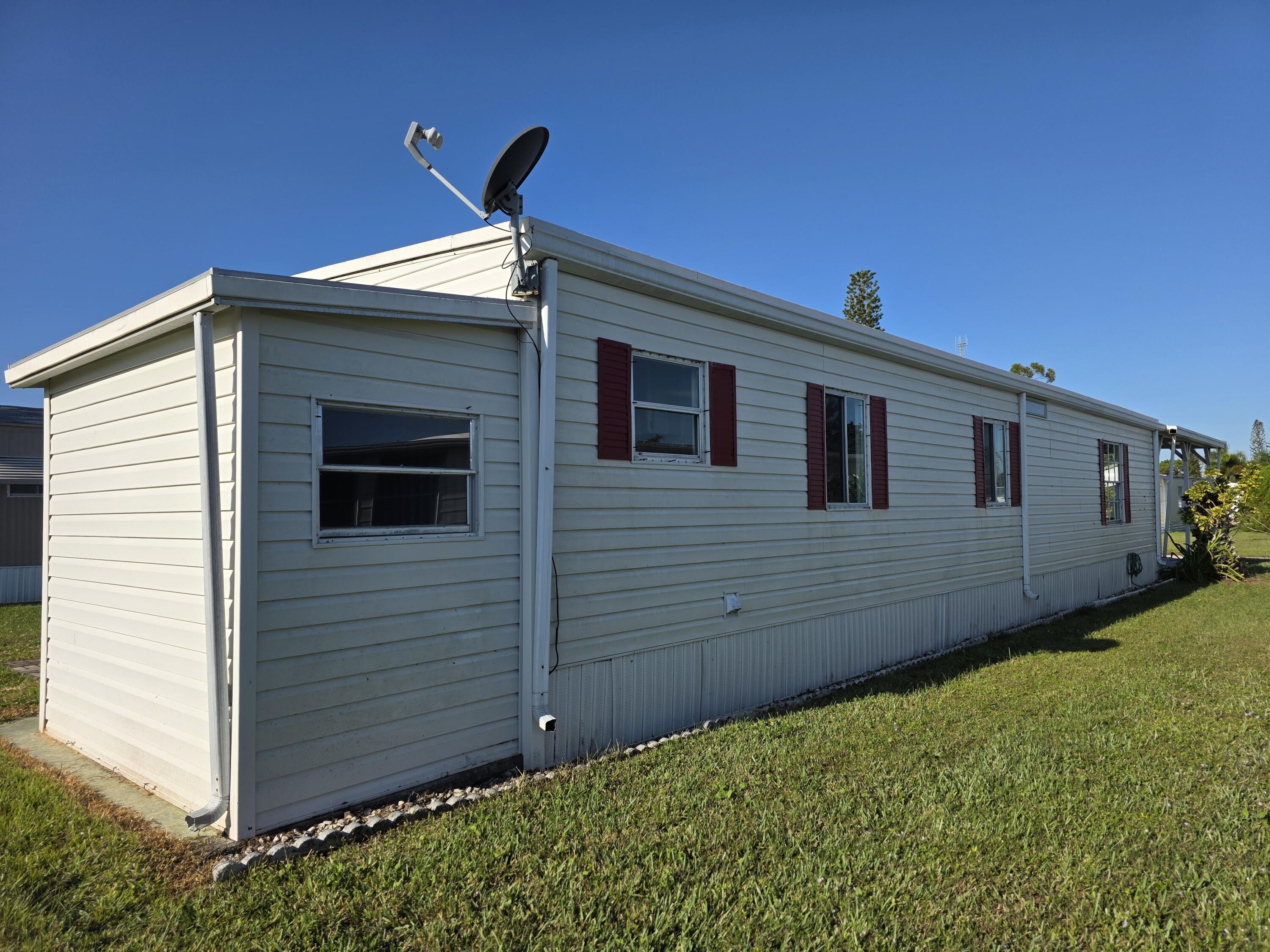 8 Del Sol Port St. Lucie, FL 34952 - Photo 3 of 26 a view of a backyard of the house