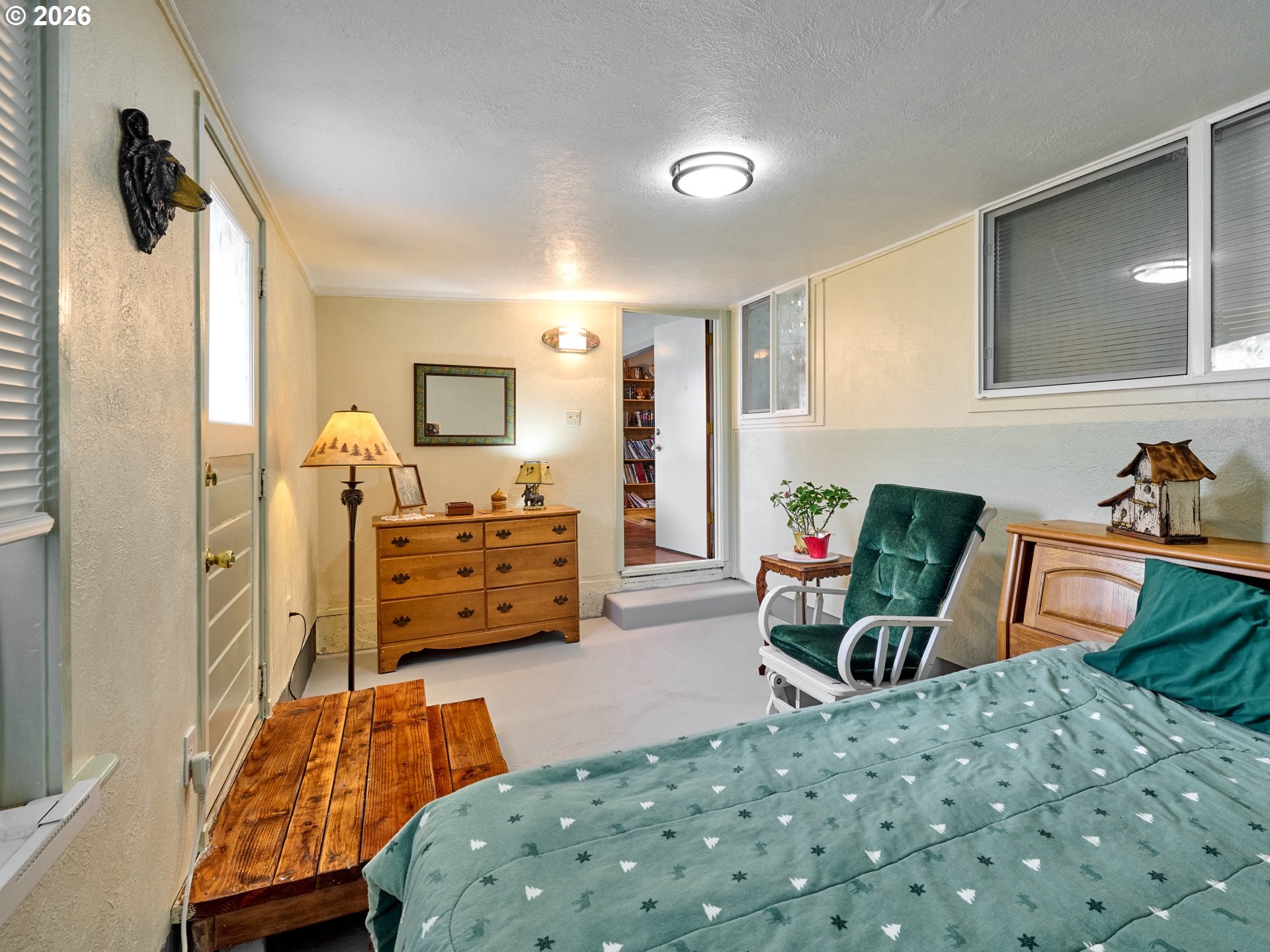 1215 Stanfield Road Woodburn, OR 97071 - Photo 15 of 29 a bedroom with furniture and a flat tv screen