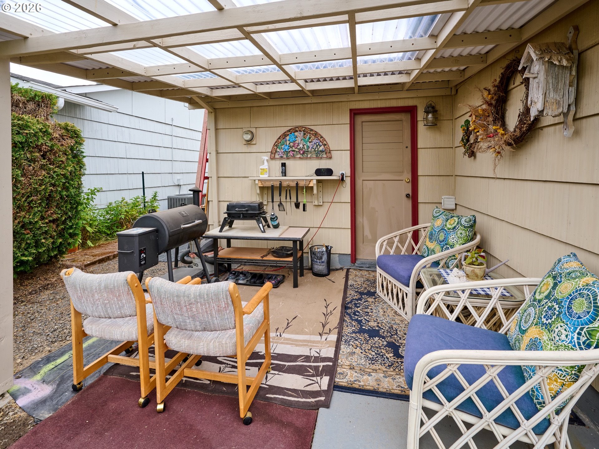 1215 Stanfield Road Woodburn, OR 97071 - Photo 18 of 29 a view of a chairs and table in a patio