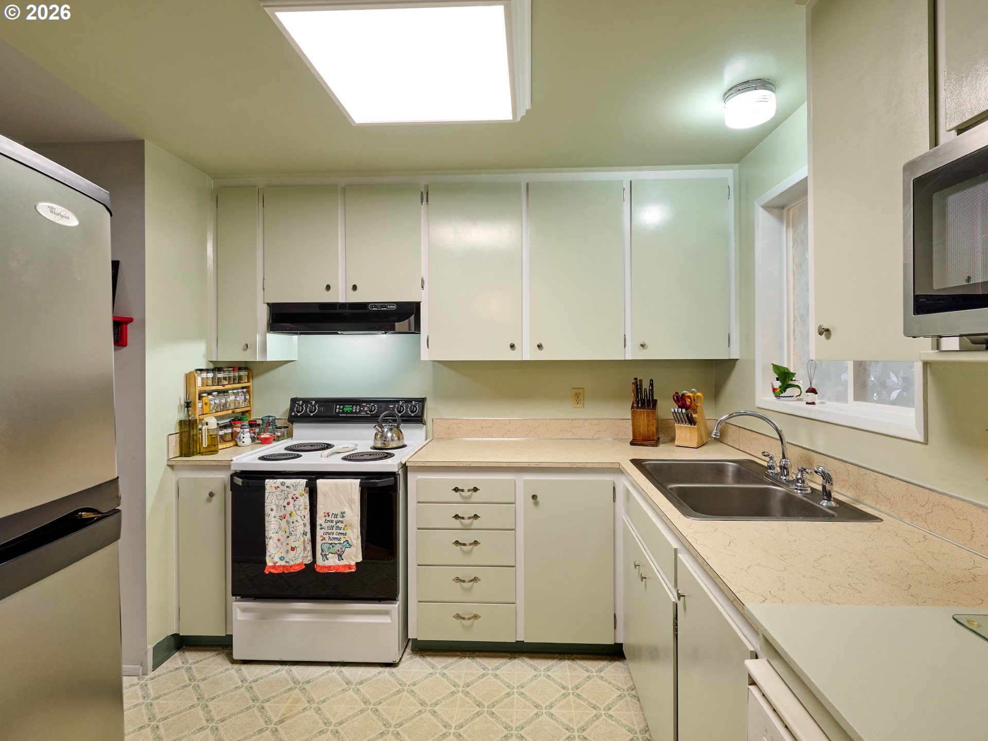 1215 Stanfield Road Woodburn, OR 97071 - Photo 9 of 29 a kitchen with stainless steel appliances granite countertop a stove sink and cabinets