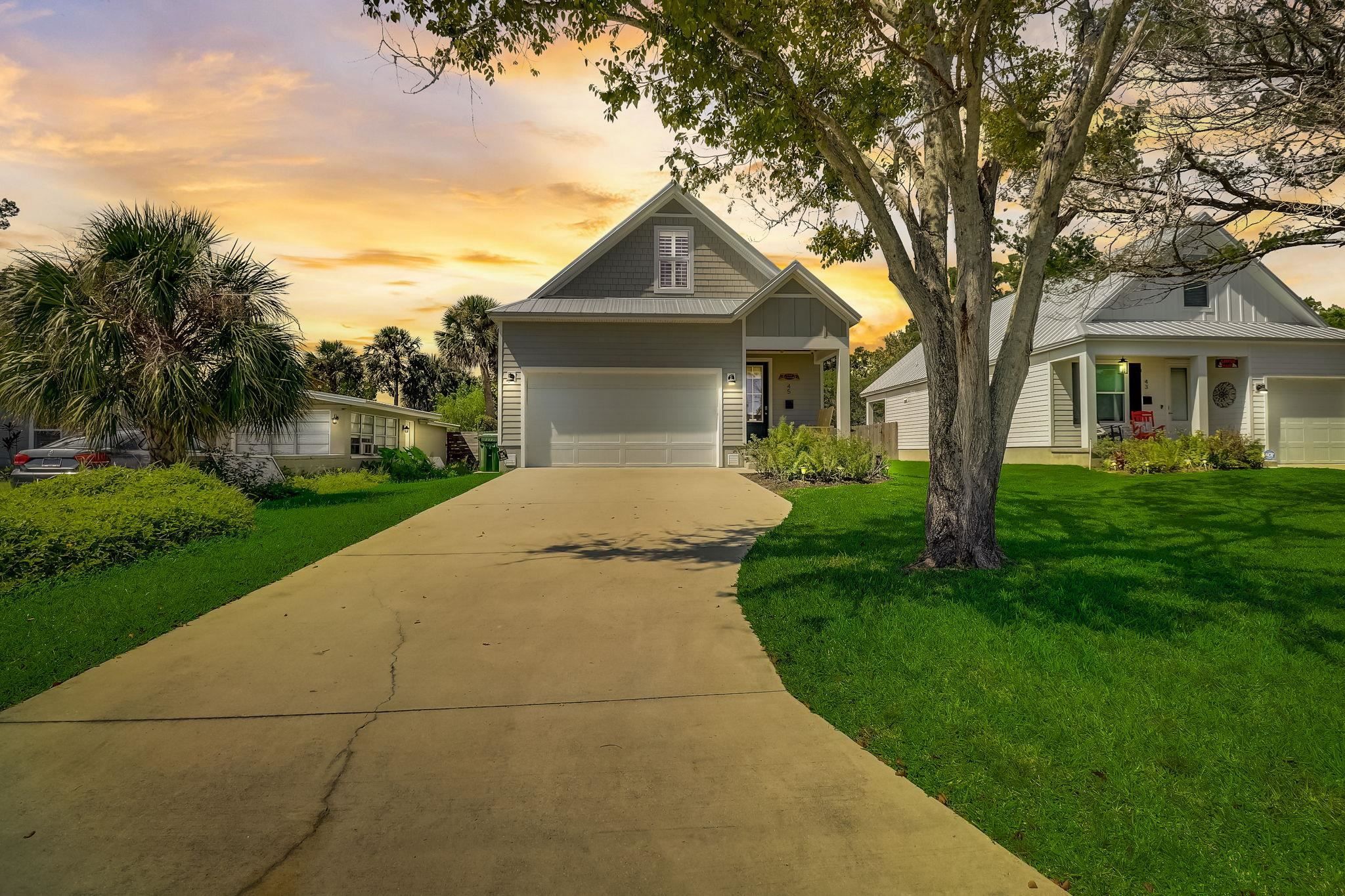a front view of a house with yard