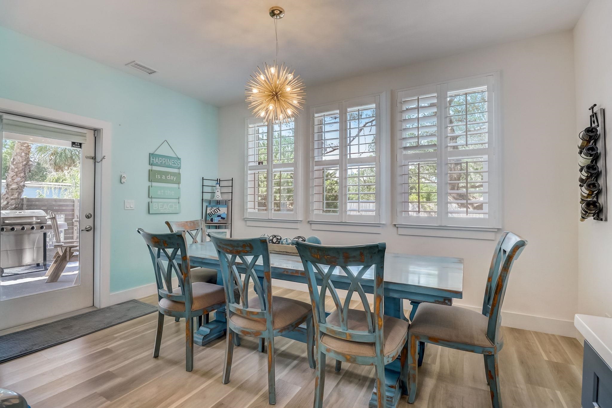 45 Menendez Road St. Augustine, FL 32080 - Photo 12 of 36 a view of a dining room with furniture wooden floor and chandelier