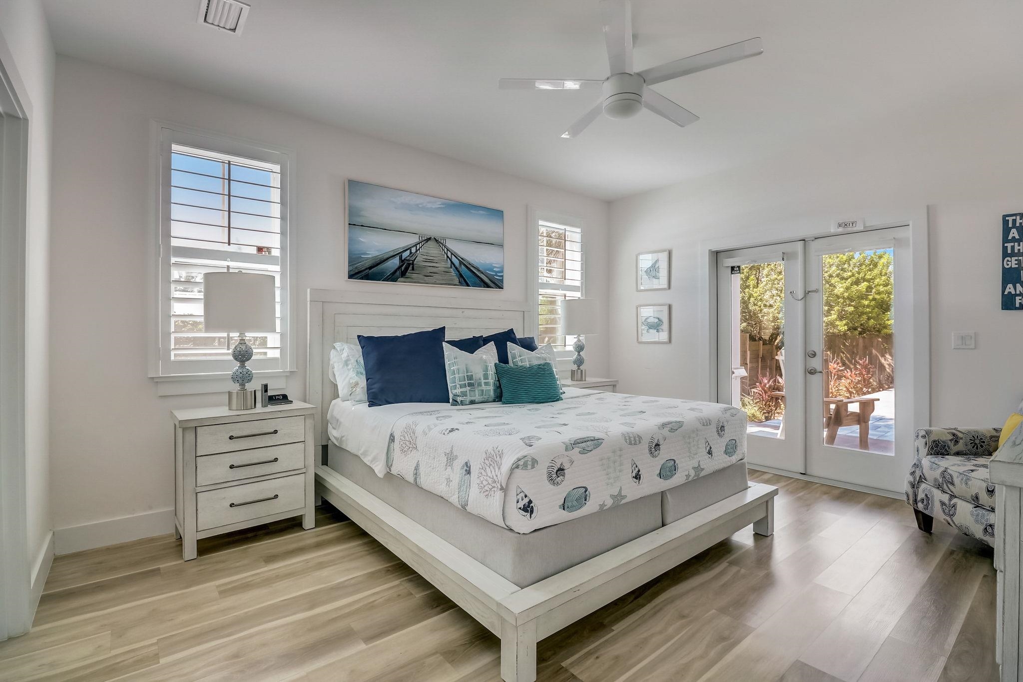 45 Menendez Road St. Augustine, FL 32080 - Photo 14 of 36 a bedroom with a bed and a chandelier