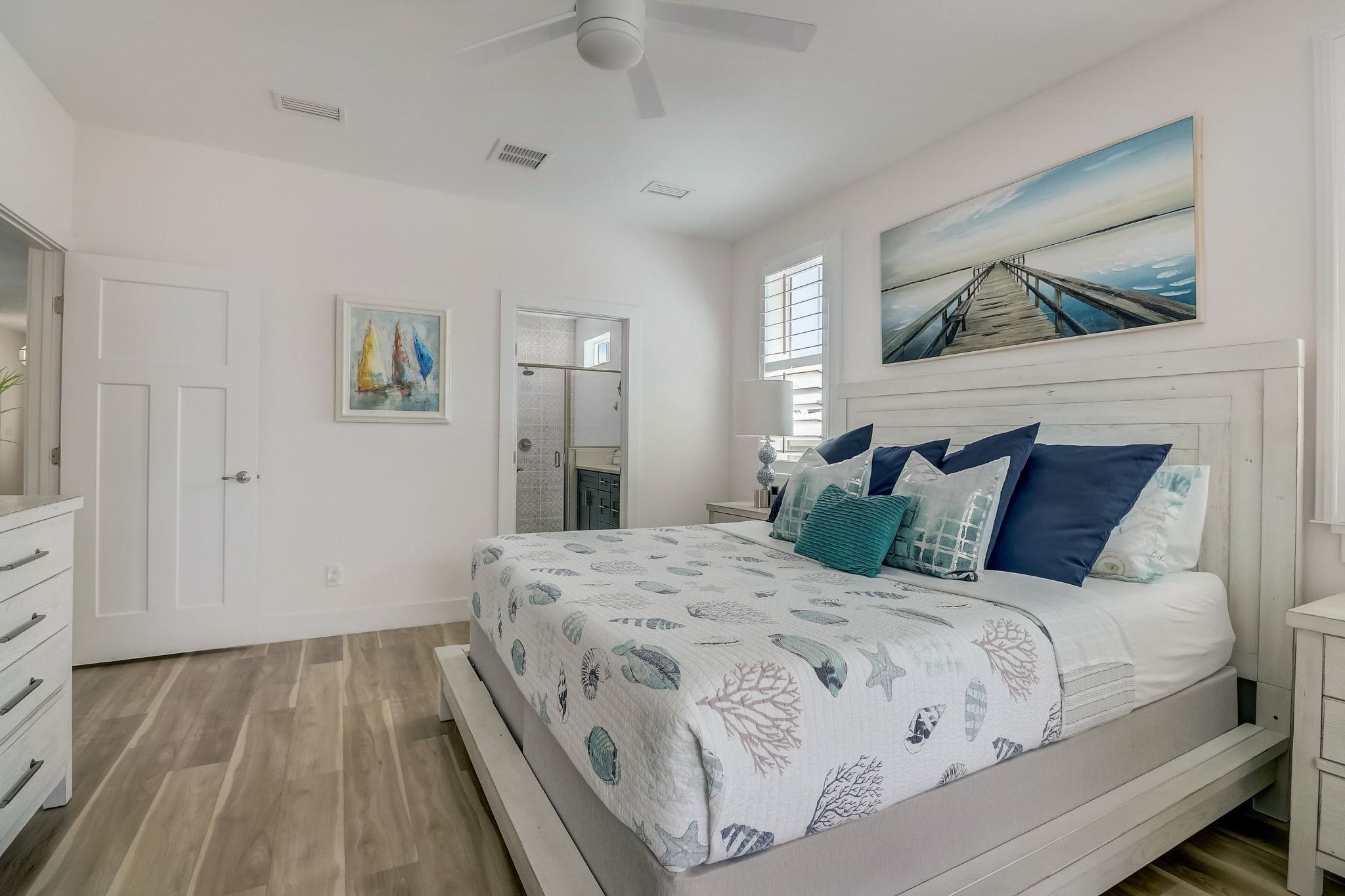 45 Menendez Road St. Augustine, FL 32080 - Photo 15 of 36 a bedroom with a large bed and a window