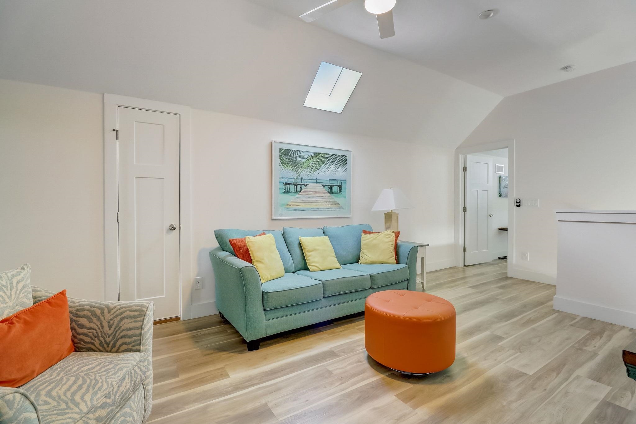 45 Menendez Road St. Augustine, FL 32080 - Photo 21 of 36 a living room with furniture and a wooden floor