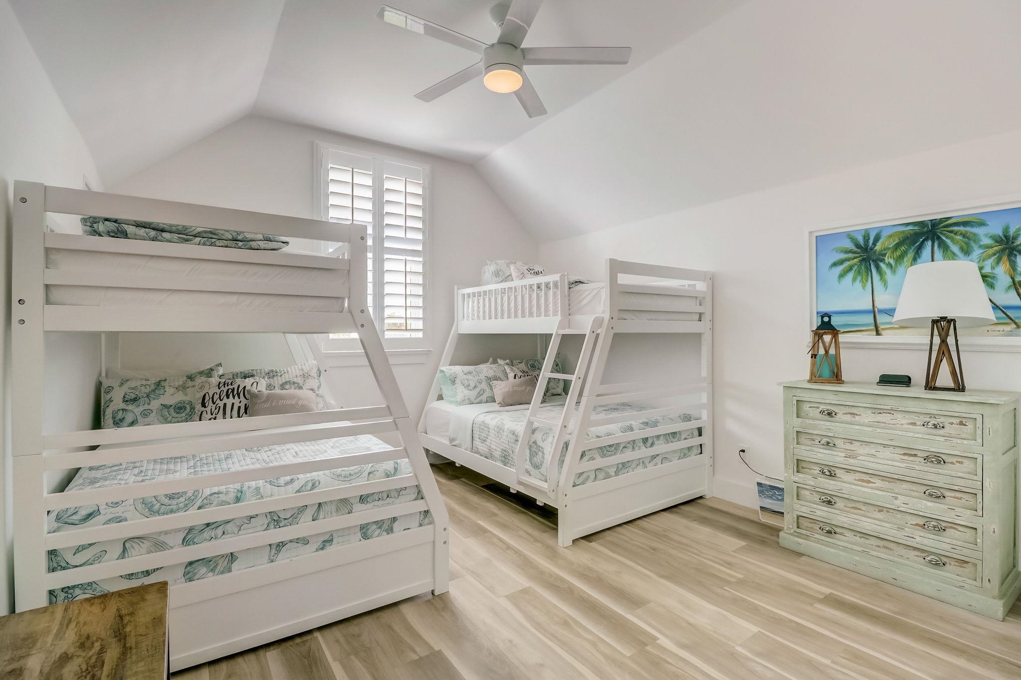 45 Menendez Road St. Augustine, FL 32080 - Photo 26 of 36 a bedroom with a bed and a chandelier