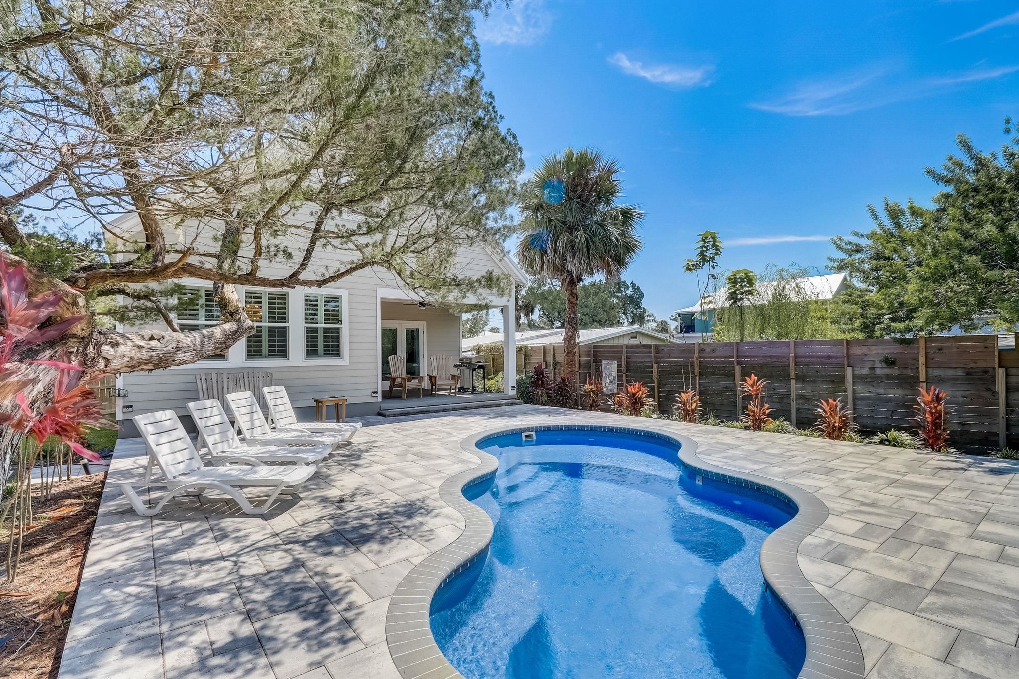45 Menendez Road St. Augustine, FL 32080 - Photo 30 of 36 a view of a backyard with swimming pool