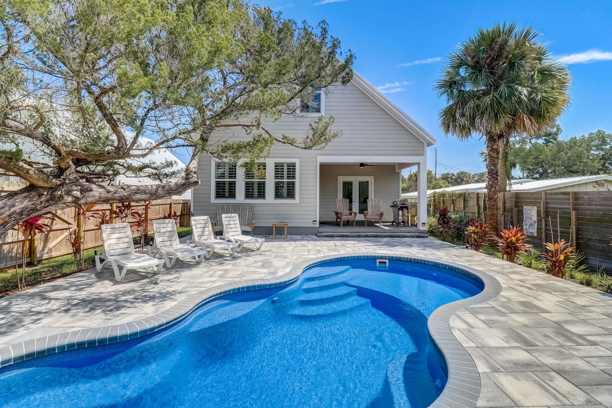 45 Menendez Road St. Augustine, FL 32080 - Photo 32 of 36 a view of a house with swimming pool and sitting area