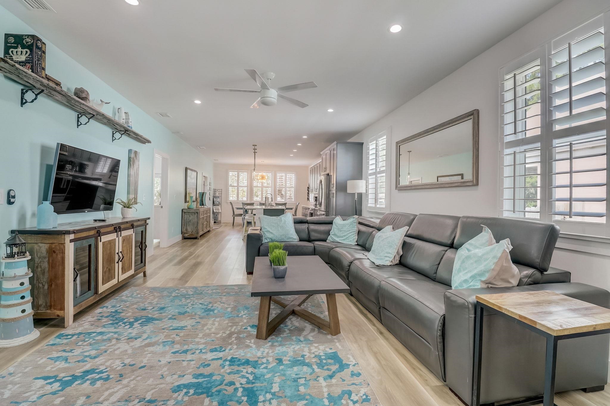 45 Menendez Road St. Augustine, FL 32080 - Photo 5 of 36 a living room with furniture a flat screen tv and a fireplace