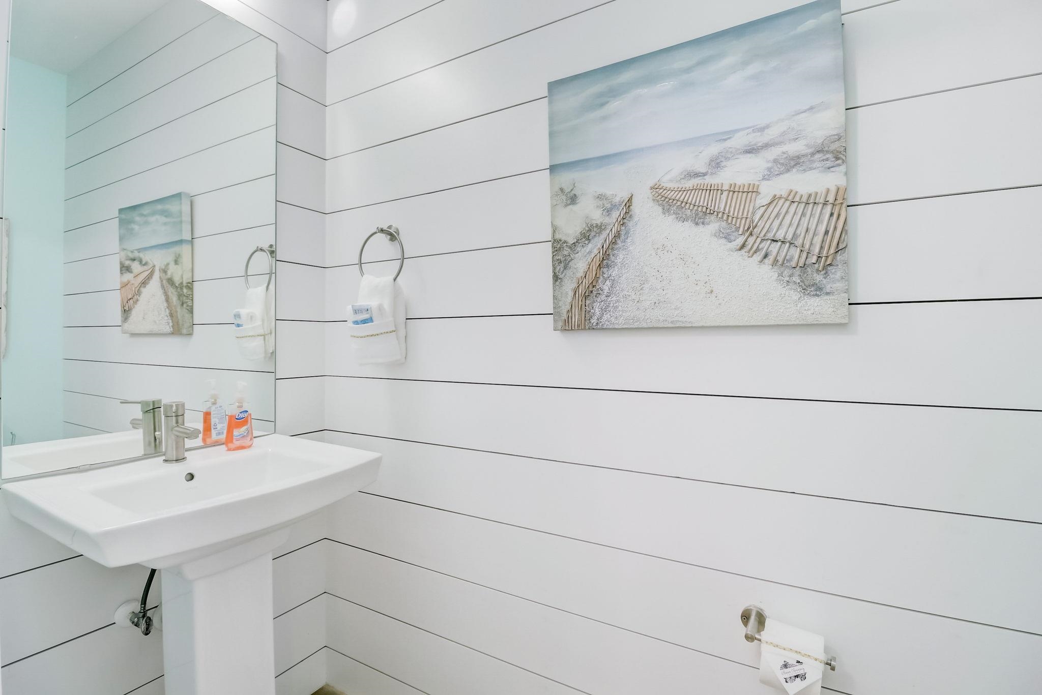45 Menendez Road St. Augustine, FL 32080 - Photo 7 of 36 a bathroom with a sink and vanity