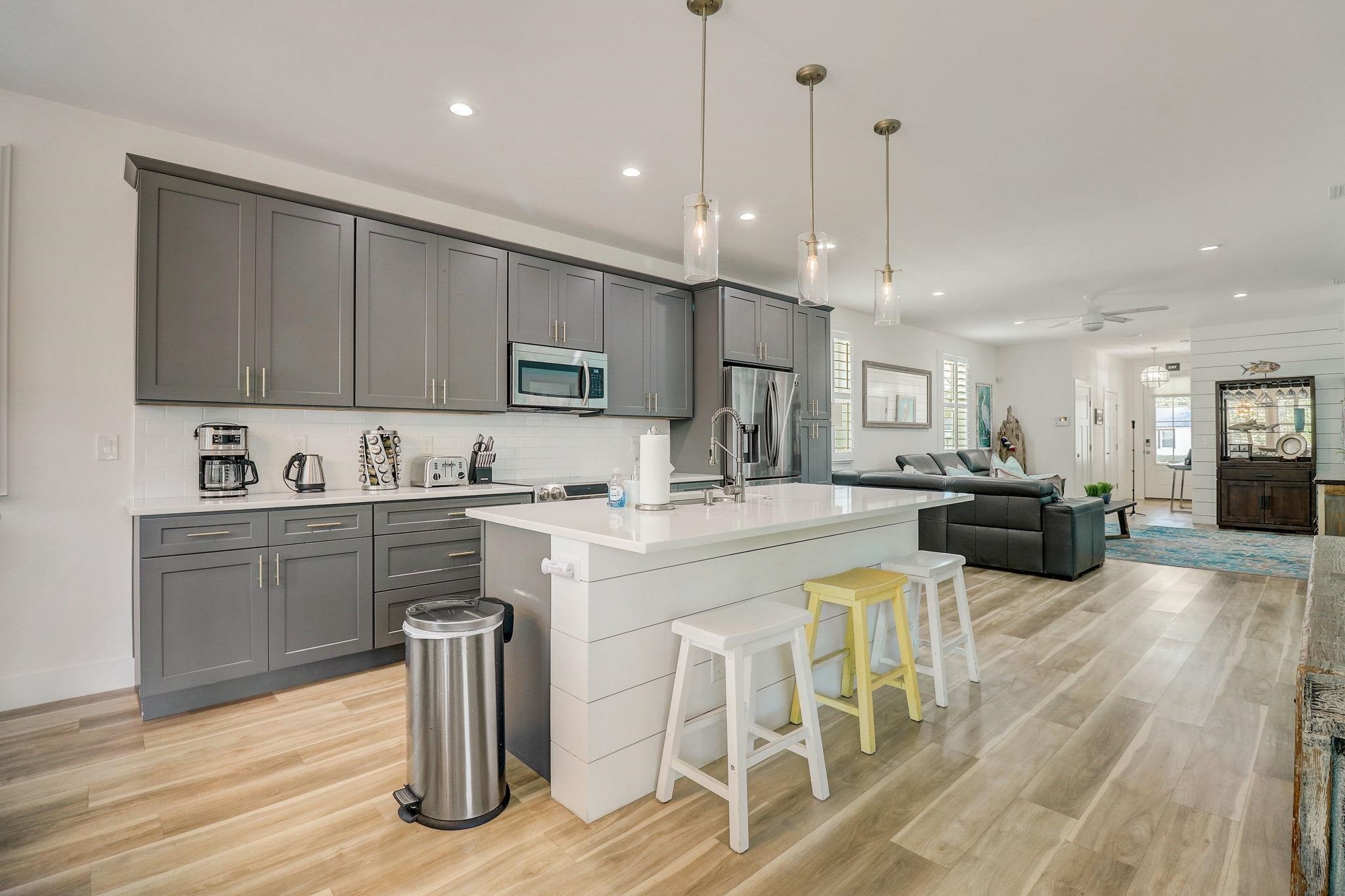 45 Menendez Road St. Augustine, FL 32080 - Photo 10 of 36 a kitchen with stainless steel appliances kitchen island granite countertop a sink and cabinets