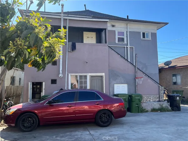 a front view of a house with parking space