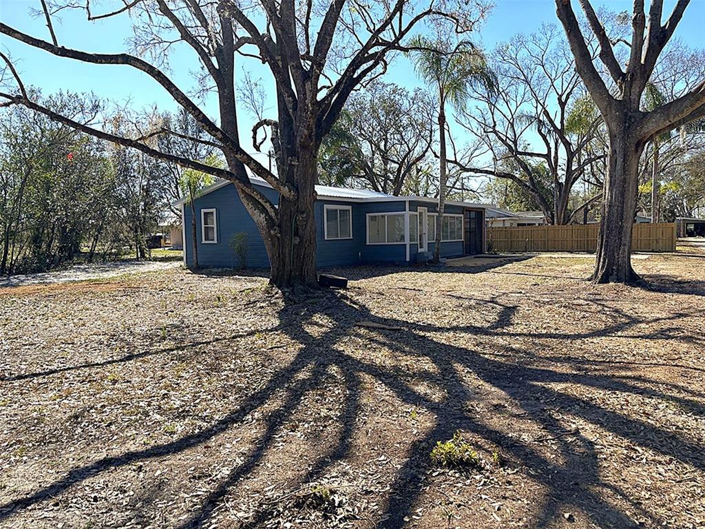 316 Brooks Road Frostproof, FL 33843 - Photo 11 of 11 a house that has a tree in front of it