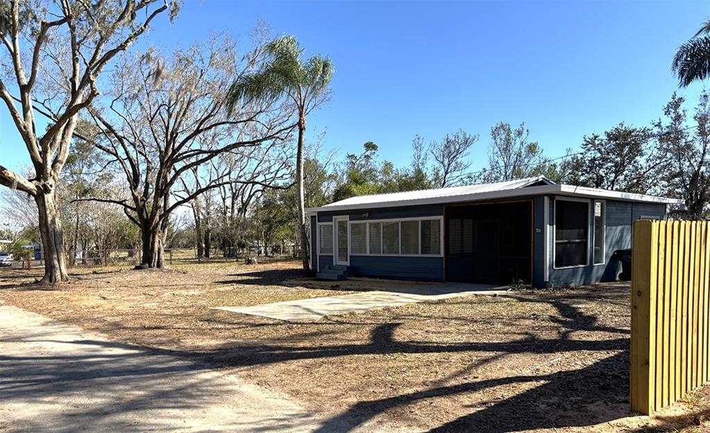316 Brooks Road Frostproof, FL 33843 - Photo 2 of 11 a view of a house with a yard