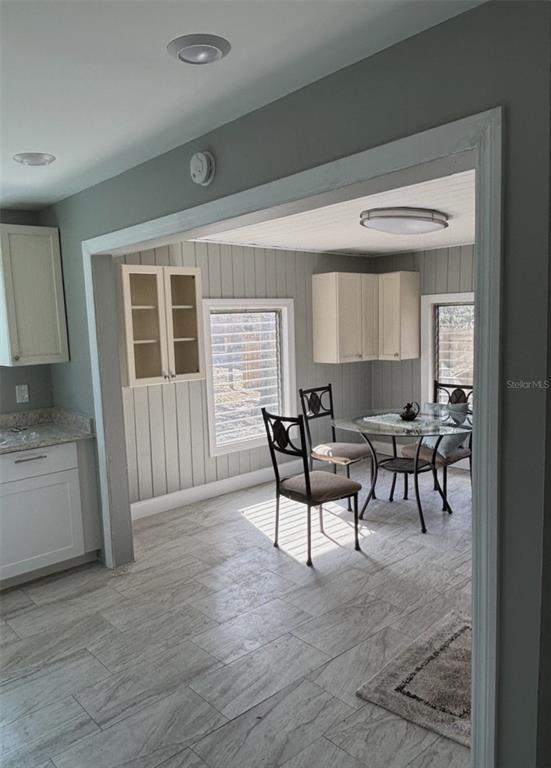 316 Brooks Road Frostproof, FL 33843 - Photo 3 of 11 a view of a dining room with furniture and a kitchen