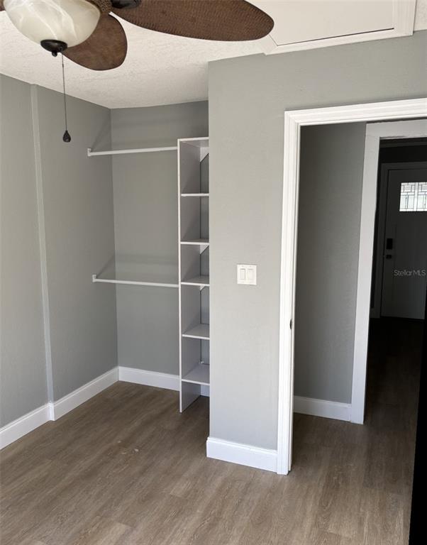 316 Brooks Road Frostproof, FL 33843 - Photo 7 of 11 a view of an empty room with wooden floor