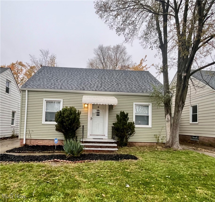 20907 Watson Road Maple Heights, OH 44137 - Photo 1 of 20 View of front of house with a shingled roof and a front lawn