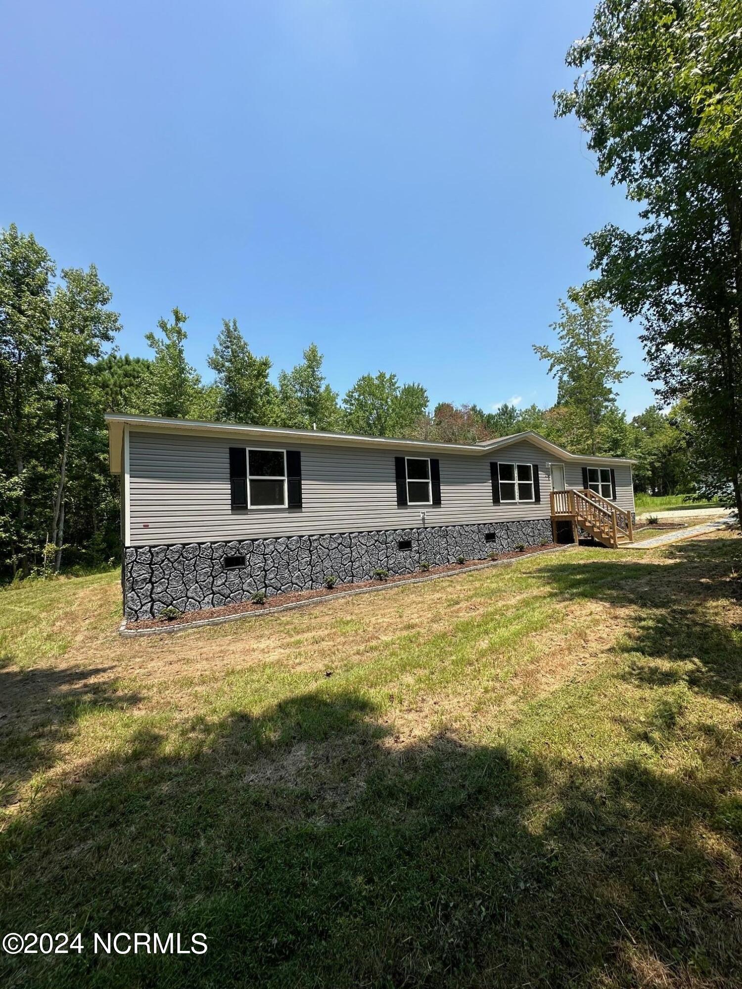 3299 Blueberry Road Currie, NC 28435 - Photo 2 of 34 left side