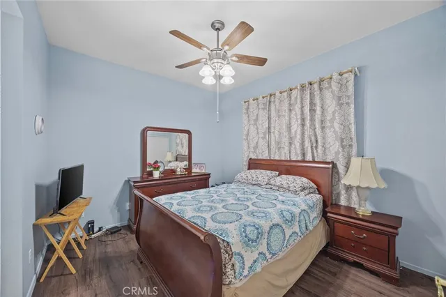 a bedroom with a bed and a table in it