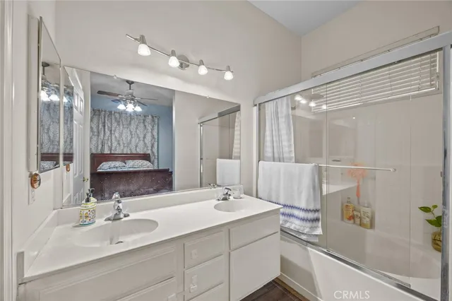 a bathroom with a sink double vanity and a mirror