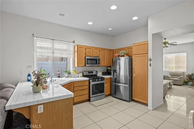 a kitchen with refrigerator and cabinets