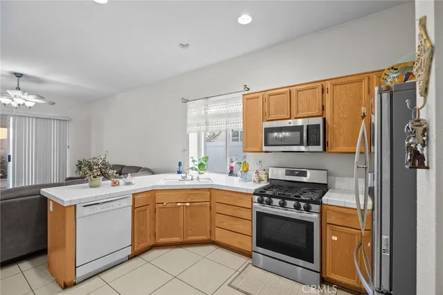 a kitchen with a stove a sink and a microwave